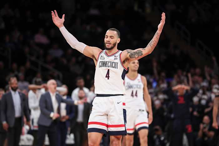 Connecticut Huskies guard Tyrese Martin (4) waves to the crowd in the second half against the Seton Hall Pirates at the Big East Tournament at Madison Square Garden.